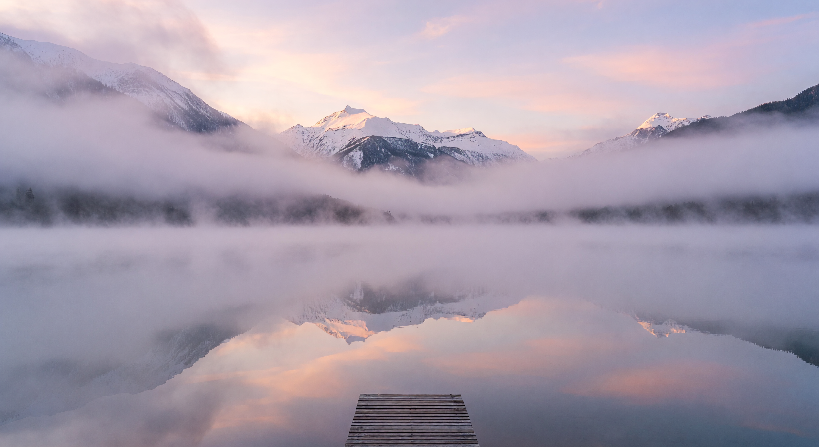 Mountain lake morning fog